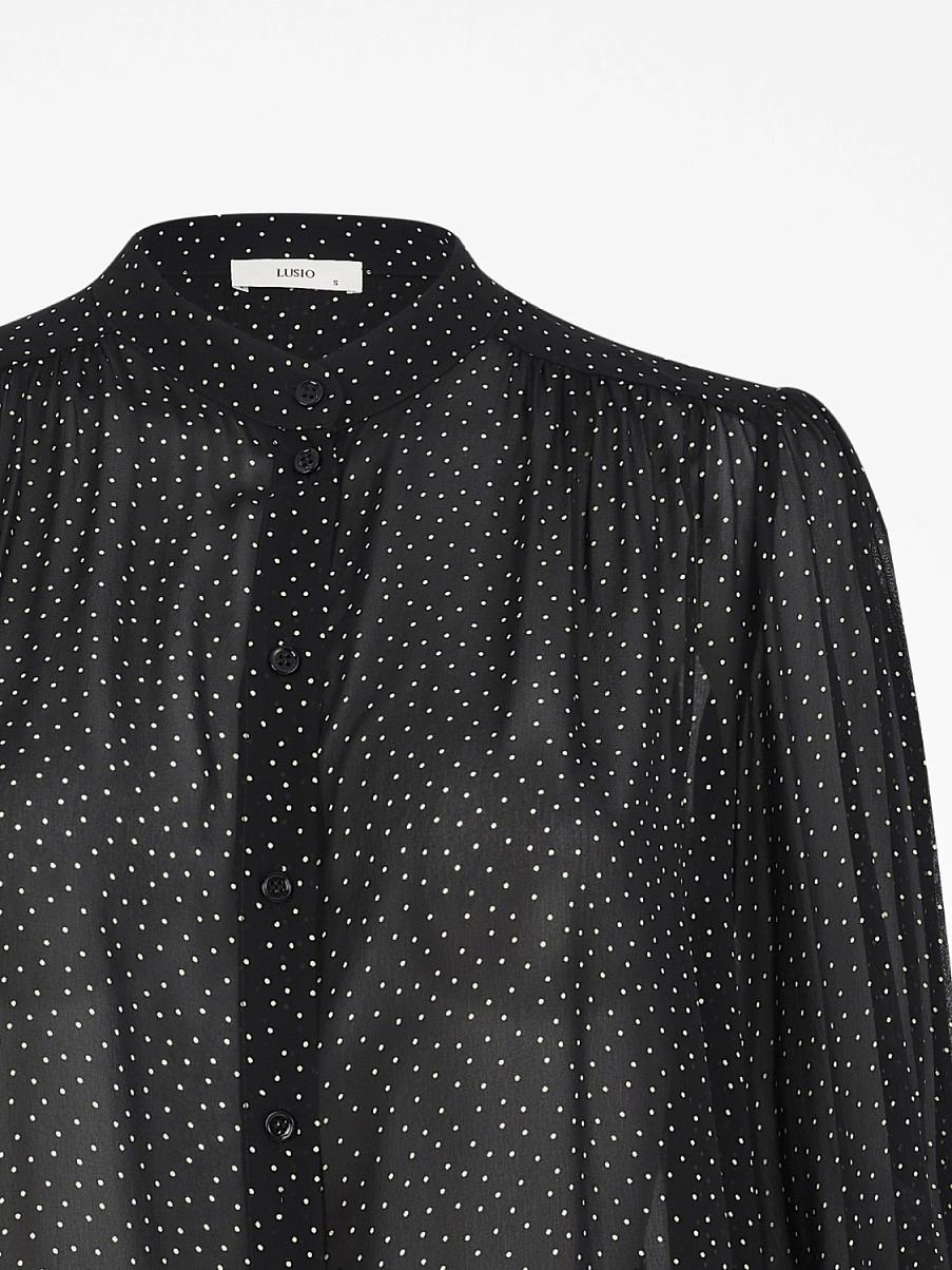 Блуза свободного кроя с узором в горошек